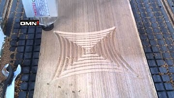OMNI CNC Router working on the wood panel