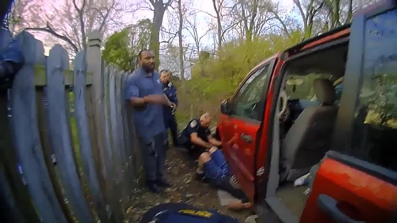 WATCH: Kalamazoo police rescue man trapped under van - YouTube