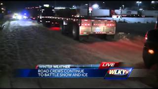Road crews continue to battle snow and ice