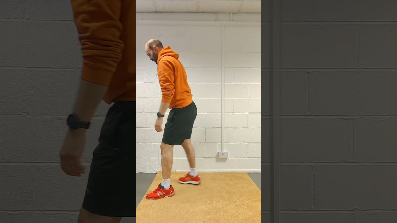 Squat jump with step back