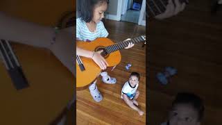 Angelica playing guitar at 7yrs old