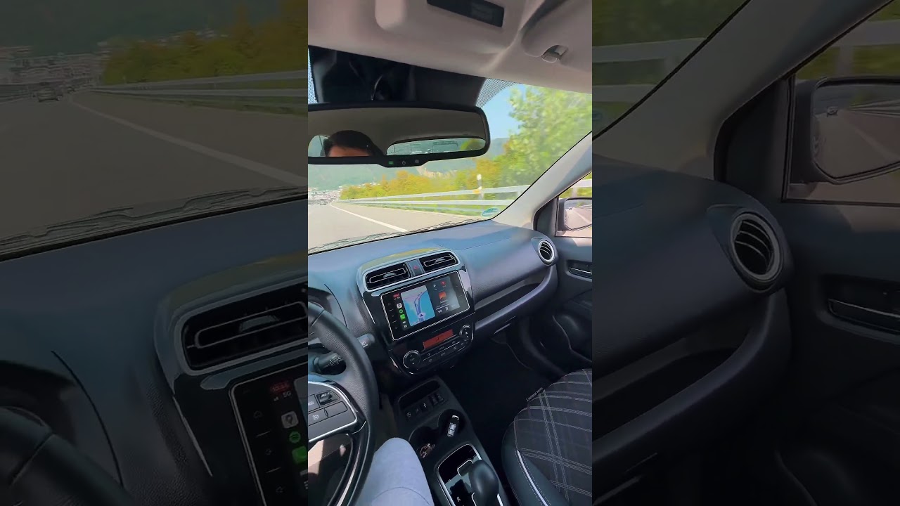 Mitsubishi Space Star 2025 driving on the lake