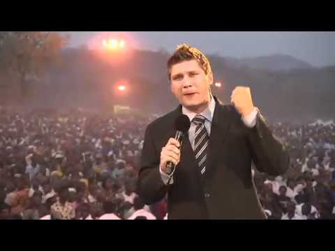 Greetings from Lokoja, Nigeria! I wish you could have been there tonight for the opening service of our Great Gospel Campaign. There is electricity in the air and great expectation for what God will do this week. On my way to the field, I saw a picture of a cloud descending on the huge crowd and I am sure that the glory of God is poised to invade this city in an extraordinary way. I preached Christ crucified tonight and then we saw the power of the Gospel demonstrated. Many thousands received salvation and many more were miraculously healed. Have a look at the attached picture of a boy who had a huge, furiously swollen abscess on his leg for 5 years. As I was praying he said he felt a "rushing wind" blow over him and the swelling miraculously disappeared! Please intercede for us throughout this week. The work happening here is a matter of life and death for multitudes of people. We are co-laborers together with you and whether your calling is to pray, to pay or to preach, each one of us is a vital link in the chain of God's purposes. Thank you for your partnership. More to come...