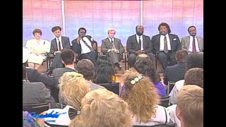 1990.  Reverend Al Sharpton, Roy Innis, and panel discuss race problems in America