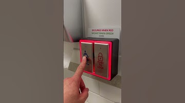 How does a push-to-lock and push-to-open button work in a universal washroom