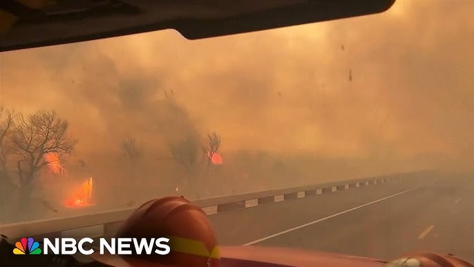 Watch Texas Firefighters Drive Along Highway Surrounded By Wildfire