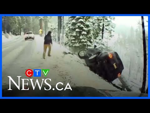 Good Samaritan rushes to help after vehicle nearly slides down snowy cliff