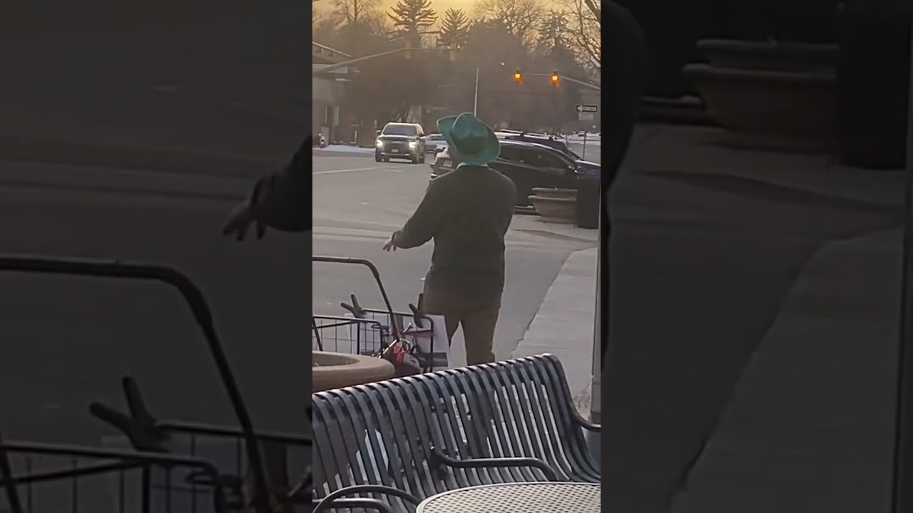 Busker in front of Ziggis Coffee in Longmont, CO