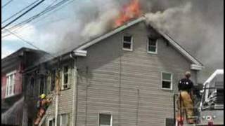Four-alarm fire hits 2 city homes
