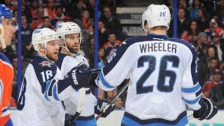 Little bats the puck out of mid-air past Talbot