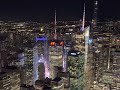 Looking over new york city at night from the top of empire state building