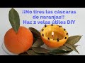 2 velas elaboradas con cáscaras de naranja. Utiliza aceite y restos de otras velas