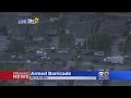 Swat team talking to armed suspect in pico rivera barricade situation