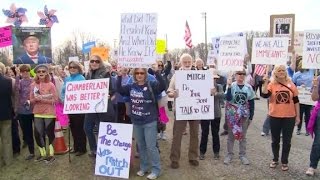 Angry voters confront lawmakers at town halls