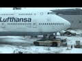 Truck Spins Tires Trying to Tow Lufthansa Plane December 2010 European Snow Storm HD