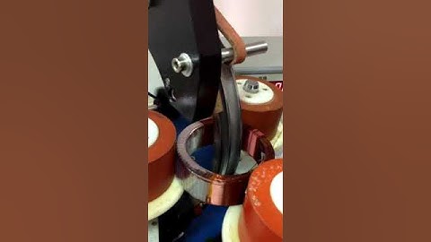 Toroid taping machine