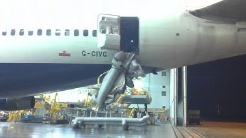 British Airways 747-400 emergency slide blowing.