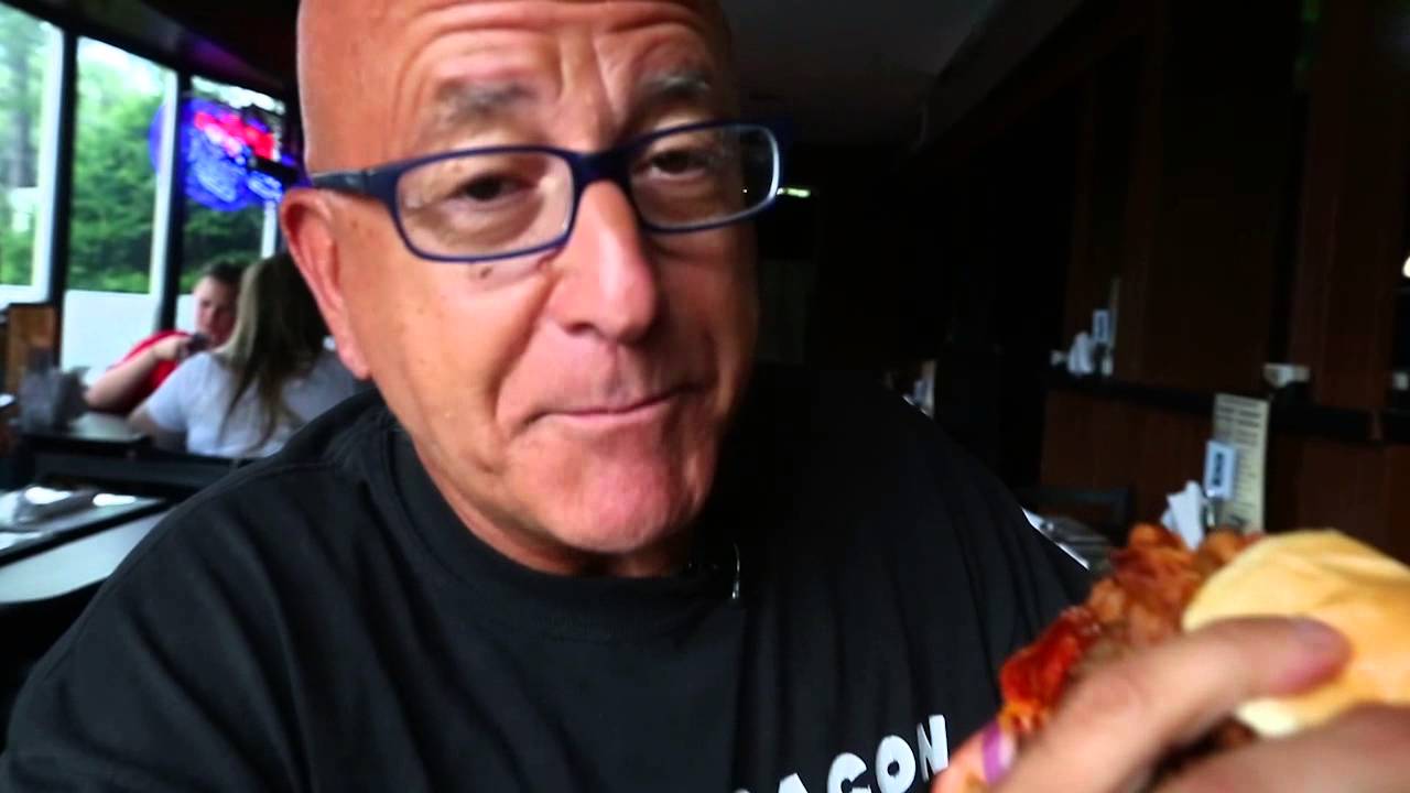 pete-genovese-attacks-the-meat-lovers-burger-at-dog-house-saloon