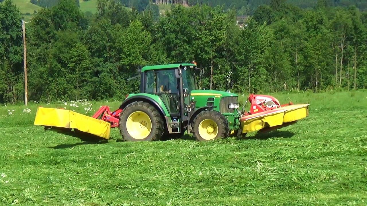 John Deere mowing grass
