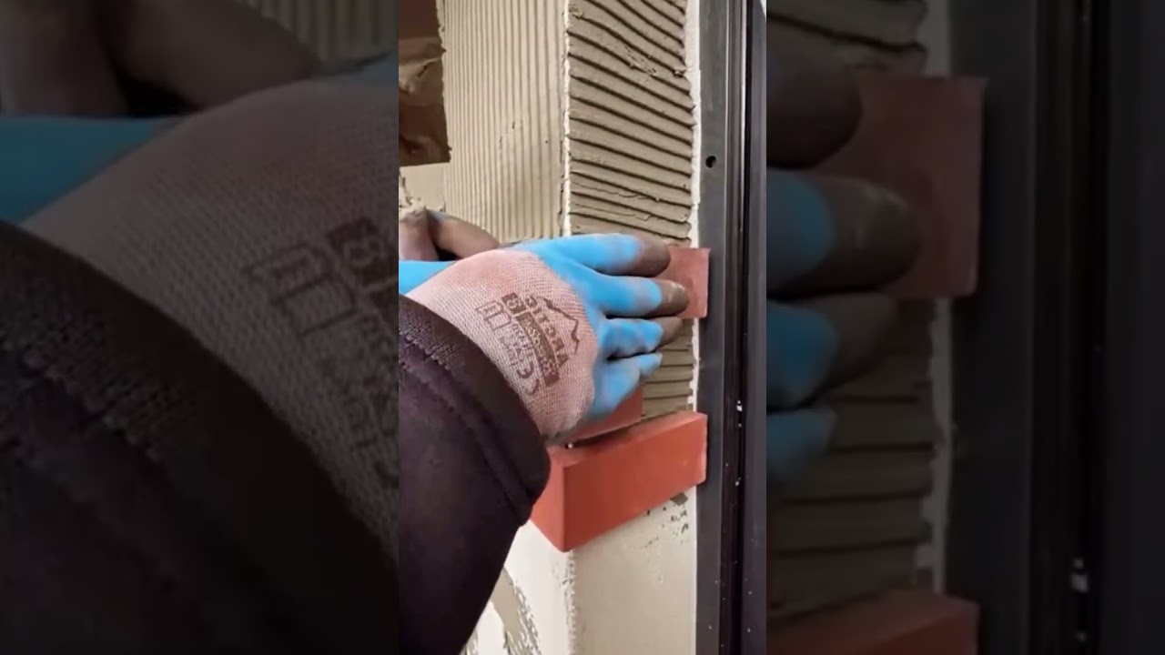 installation of small unique tiles on the wall 