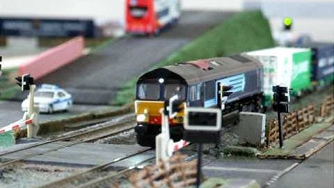 DRS Class 66 and Container Train pass a EWS Class 66 going north