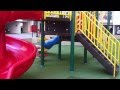 Children Playing In The Park With Roundabouts, Swing, Slide, SeeSaw by JeannetChannel