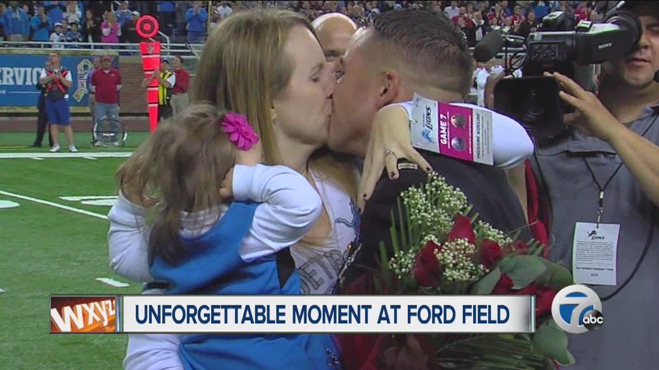 Marine surprises wife and kids at Detroit Lions game