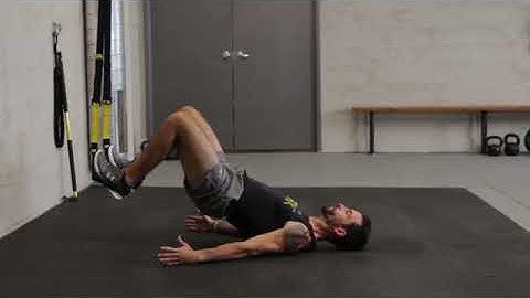 How to do a TRX: Glute Bridge | Proper Form & Technique | NASM