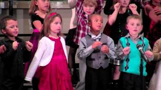 Kindergartners take the stage for holiday caroling