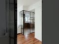 Black Steel Frame Glass Partition Transforms This Apartment Kitchen