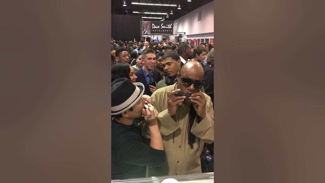 Stevie Wonder playing Suzuki chromatic harmonica at Namm show 2017