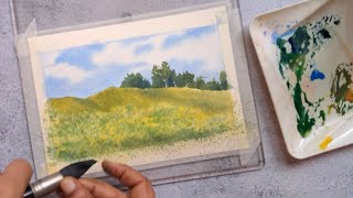 Watercolor landscape painting.  Spring flower field painting with step-by-step instructions