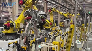 Our fixtures and safety fences are equipped with FANUC robots and automated spot welding.#robot