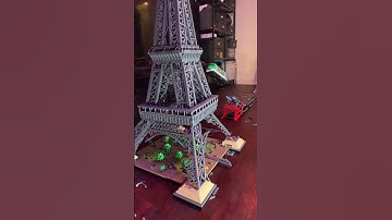 A Lego train destroys the Lego Eiffel Tower