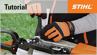 Lubricating the gears of a STIHL petrol hedge trimmer