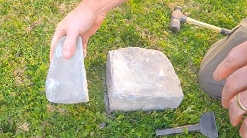 Cutting Landscaping Block With Hammer And Chisel