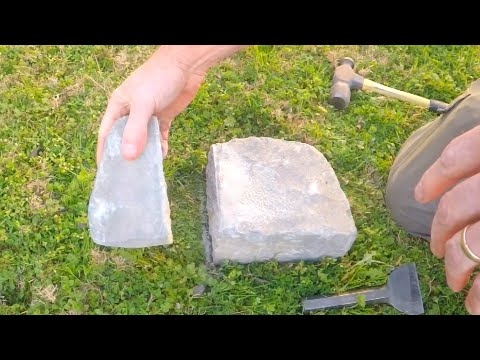 Cutting Landscaping Block With Hammer And Chisel