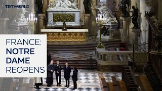 French president tours cathedral before next month’s reopening