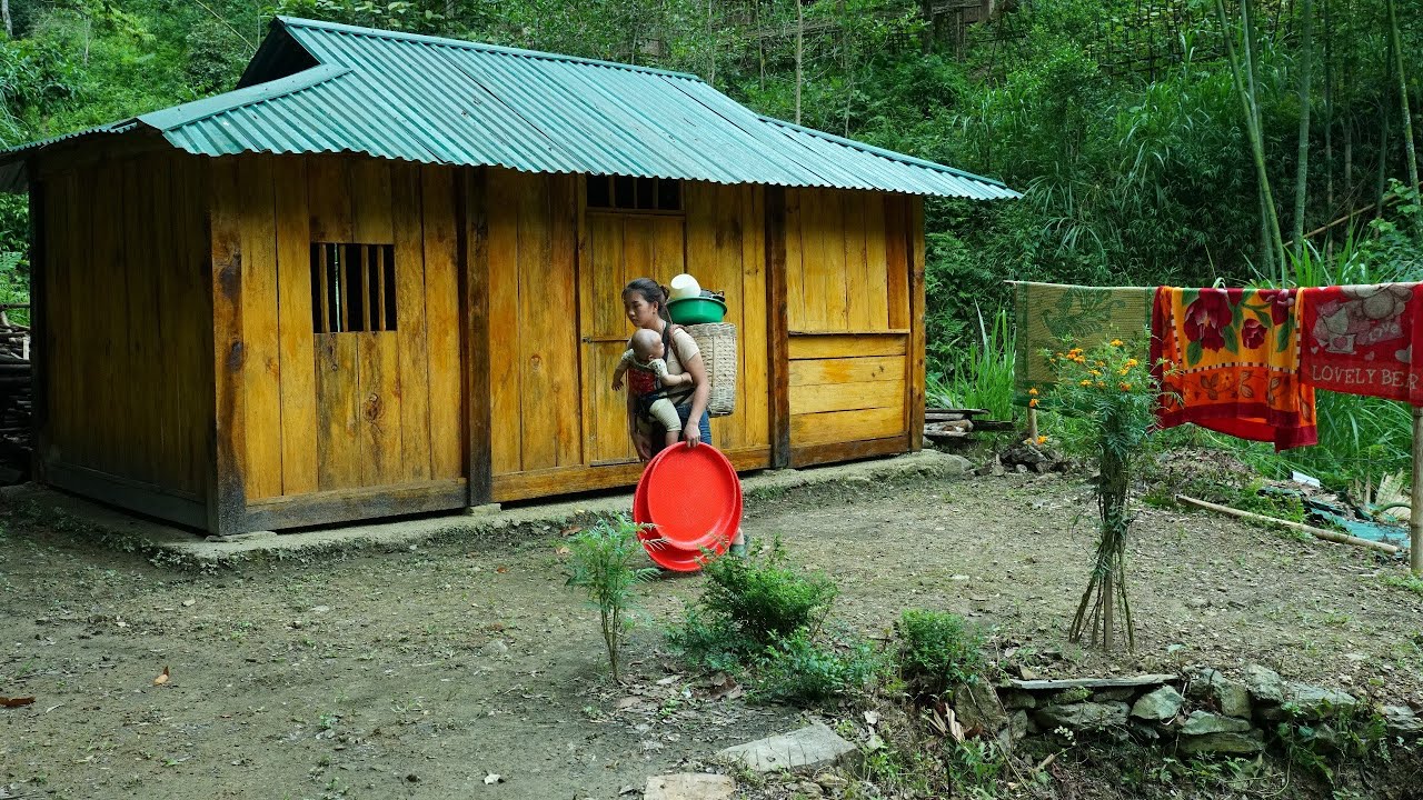 The single mother continues her work renovating the wooden house.