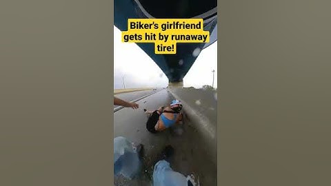 #Biker's #girlfriend gets #hit by #runaway #tire! Good thing she had a #helmet on.