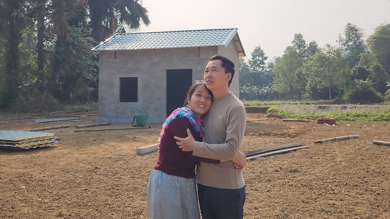 With Nam's help, Hong Thai installed a corrugated iron roof to further complete her dream house.