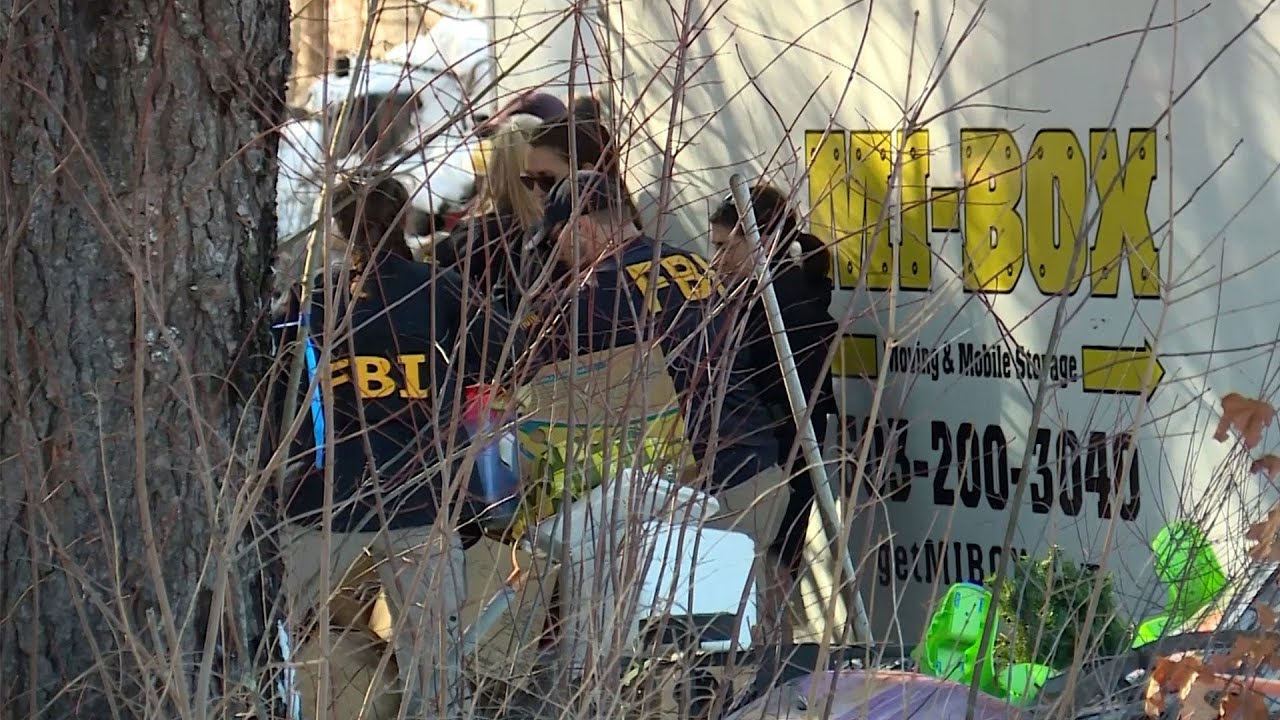 FBI agents spotted sifting through boxes outside Waterboro home