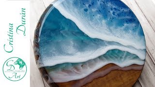 I’m creating a beach on this wood plate using epoxy resin and
pigments. the in tinted mixed to suggest waves, doing several layers
complet...