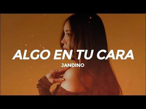 Jandino - Algo En Tu Cara (Letra/Lyrics)