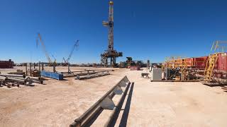 Time lapse of an oil rig raising itself up with hydraulics.