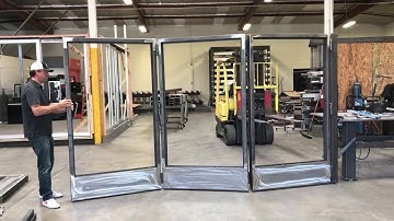 Steel bi-folding doors without track system