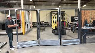 Steel bi-folding doors without track system