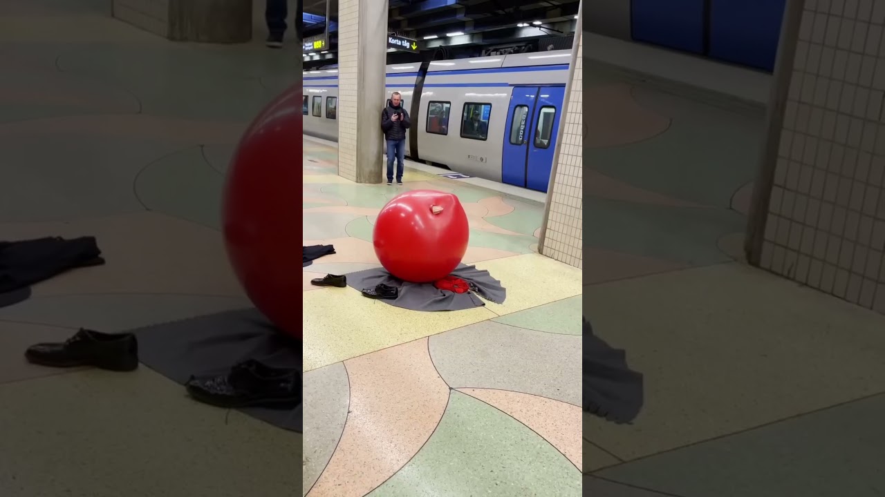 this man entertains people at the railway station 