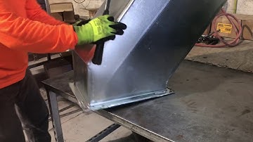 Hammering the TD Flange over itself to secure Corners in this Rectangular Offset