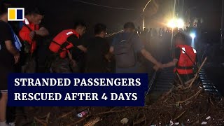 Beijing team launches rescue to save 1,000 train passengers stranded for days amid heavy rain